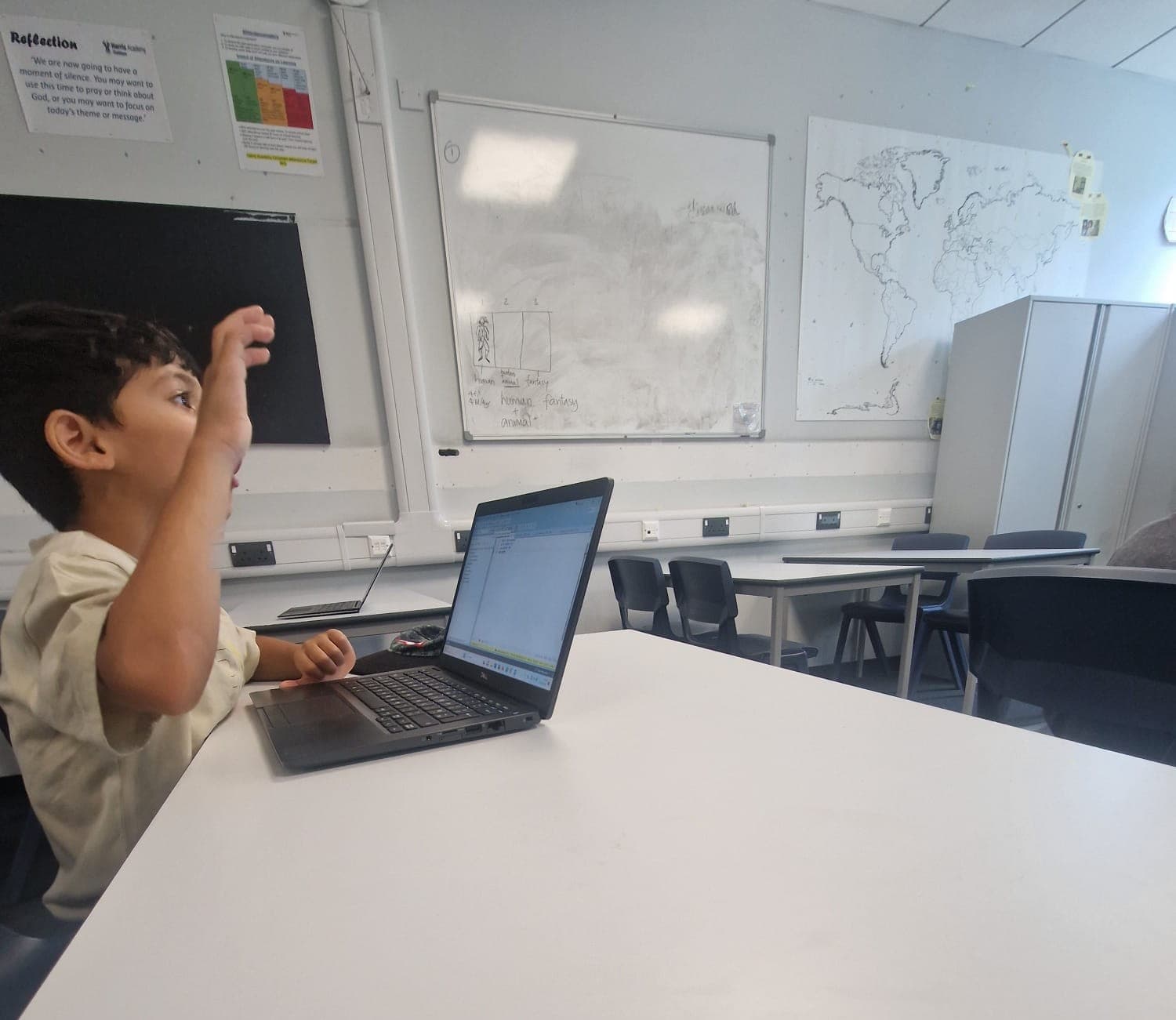 A young person celebrating a coding win at Youth Active